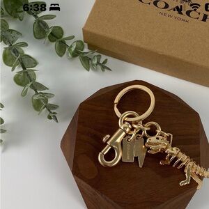Coach Metallic Gold T-Rex Keychain
